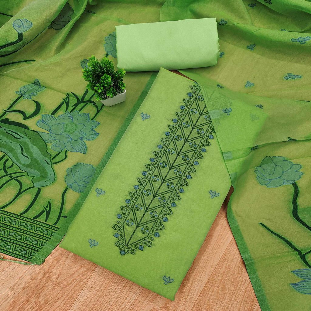 Green Ethnic Dress Material Showcasing Handloom Style Floral Zari Weaving