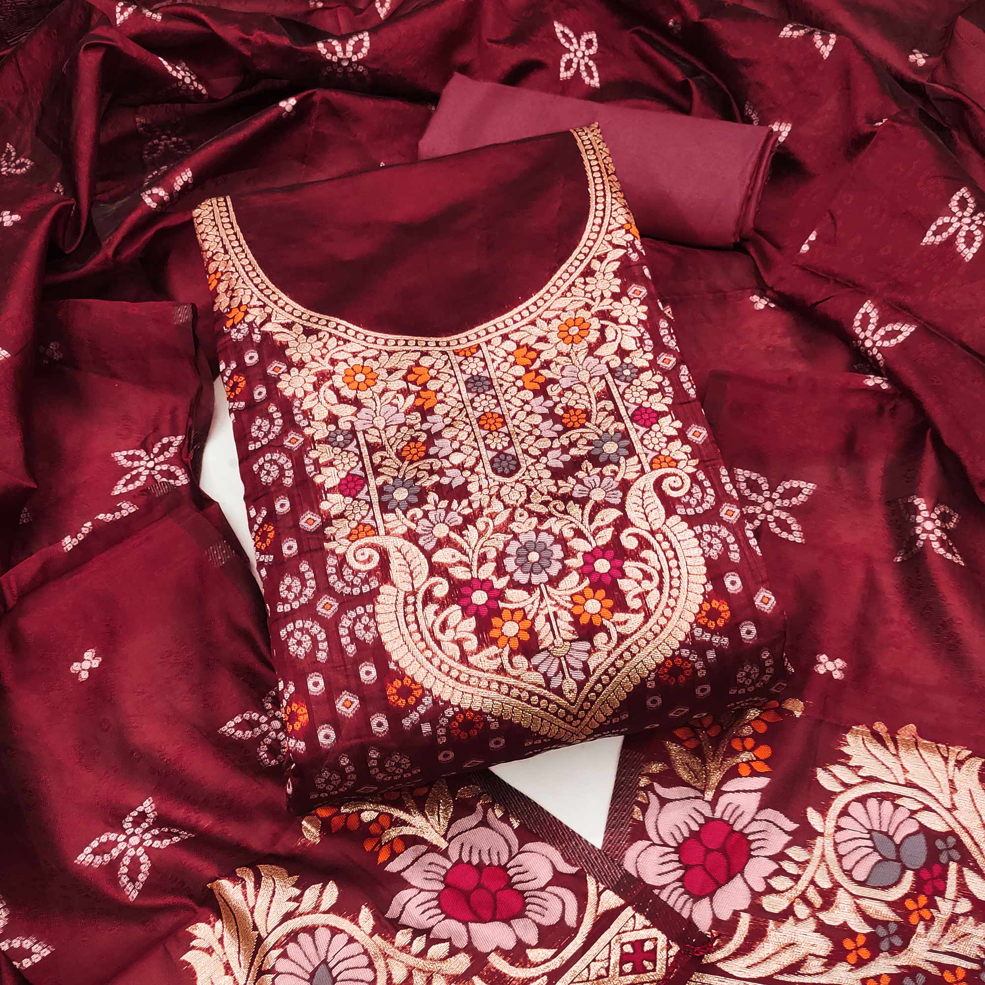 Maroon Banarasi Silk Jacquard Dress Material Adorned With Intricate Floral Zari Weaving