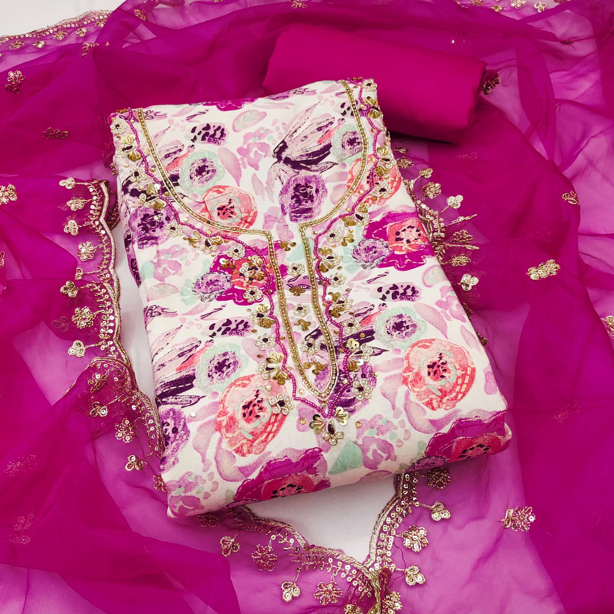 Pink Printed Blue Pure Cotton Dress Material Enhanced With Moti & Hand Embroidered Sequins