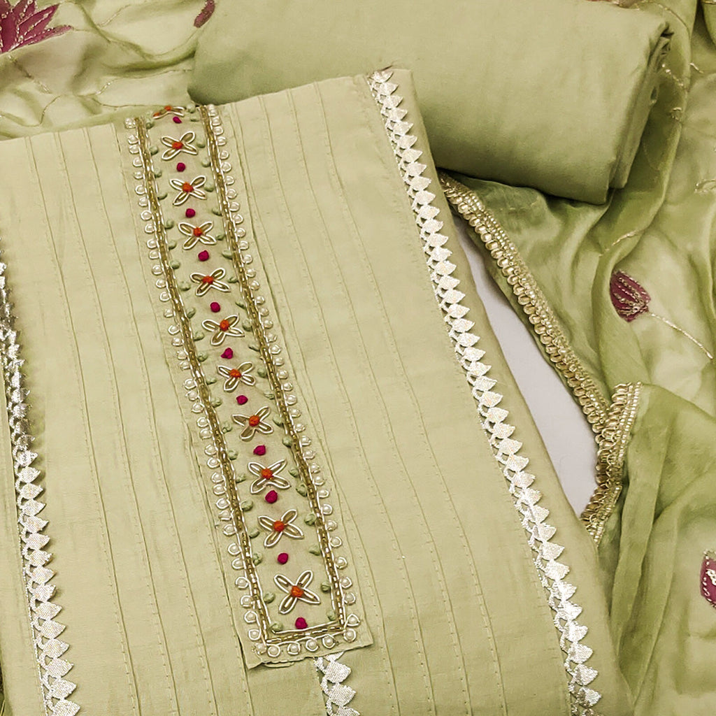 Green Cotton Silk Dress Material Embellished With Elegant Moti Handwork & Delicate Gota Patti Lace