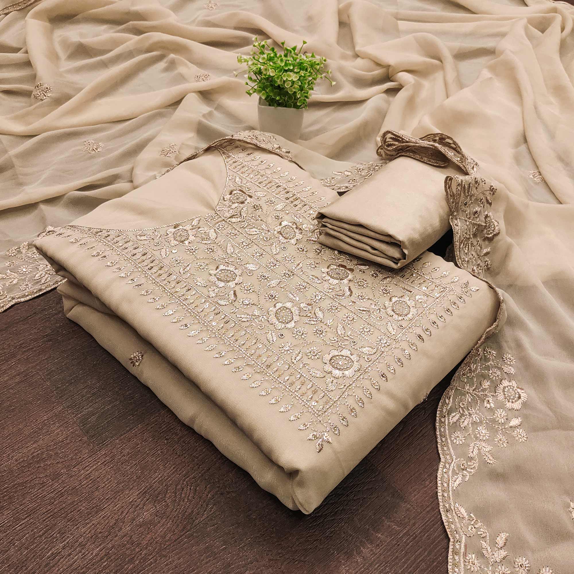 Chikoo Georgette Dress Material With Intricate Floral Zari Embroidery & Sequins Work