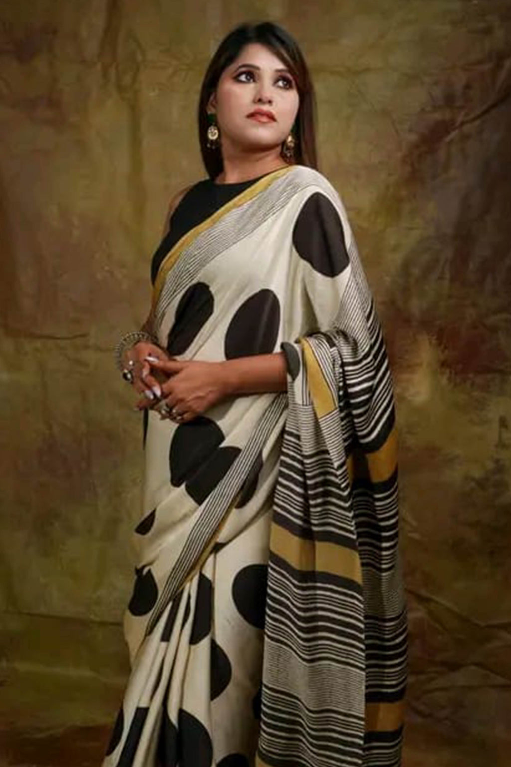 Graceful Offwhite Satin Saree Featuring Geometric & Striped Print With Tassel Pallu