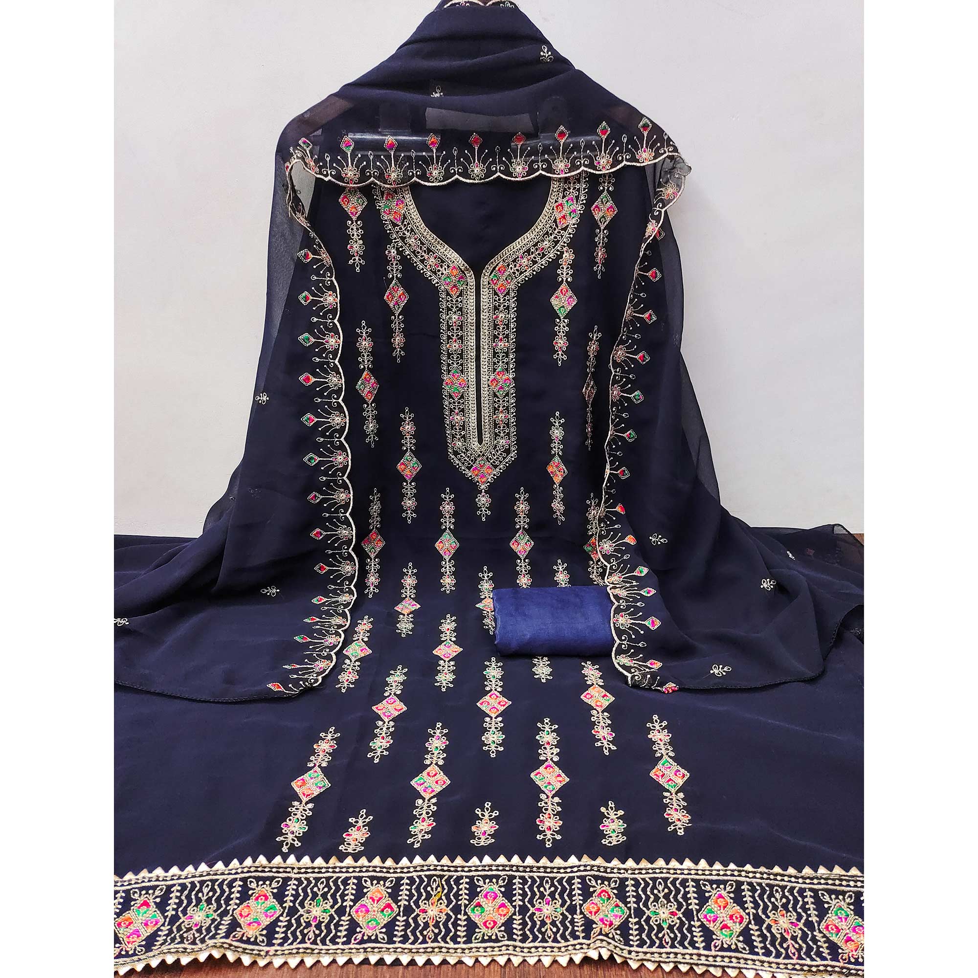 Blue Georgette Dress Material Enhanced With Graceful Floral Embroidery For An Elegant Ethnic Look