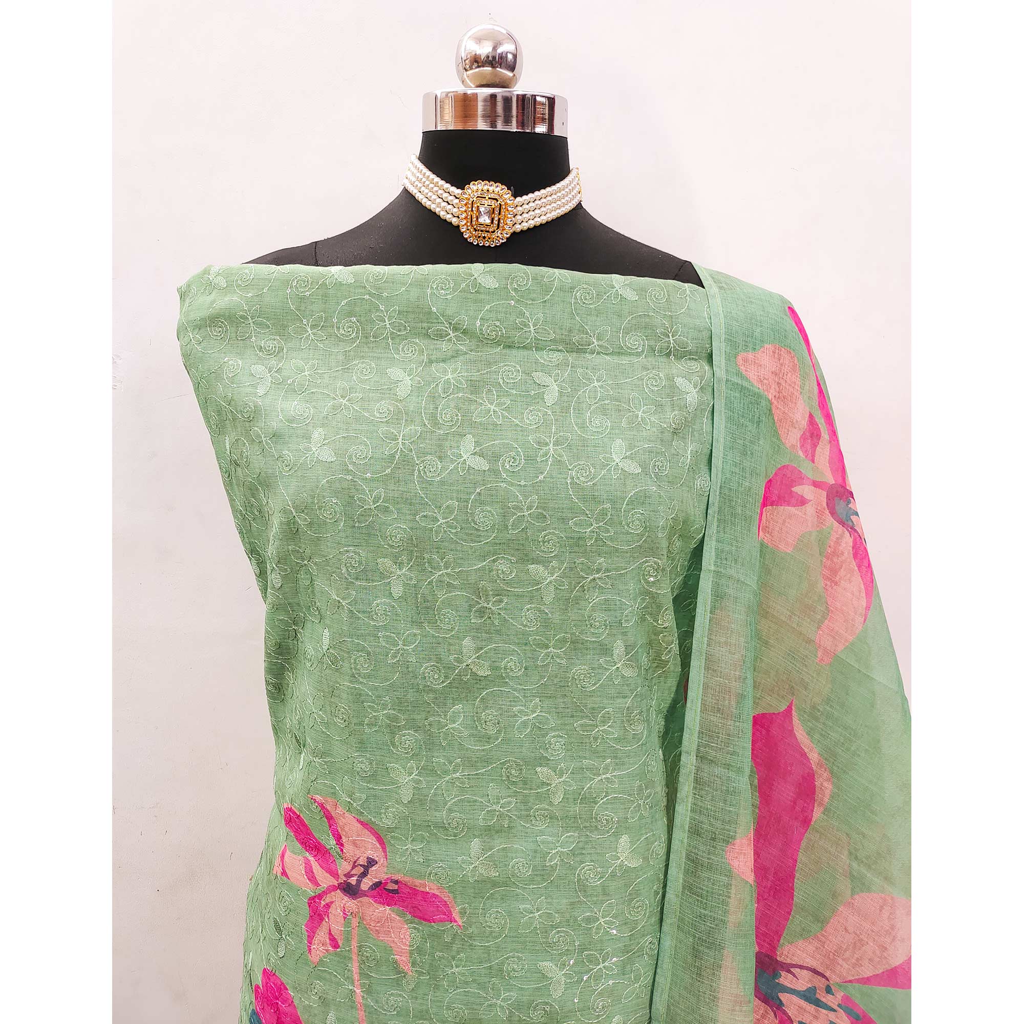 Green Linen Dress Material Adorned with Artistic Floral Print and Elegant Thread Embroidery